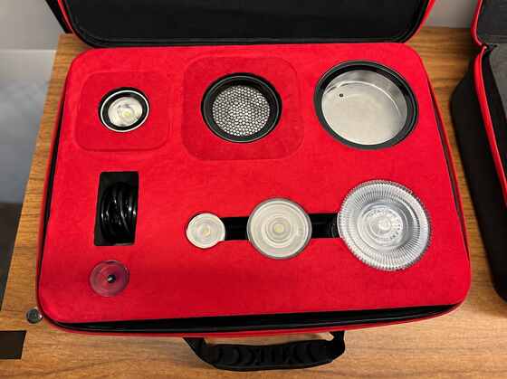Red velvet-finished EVA insert holding lighting equipment components