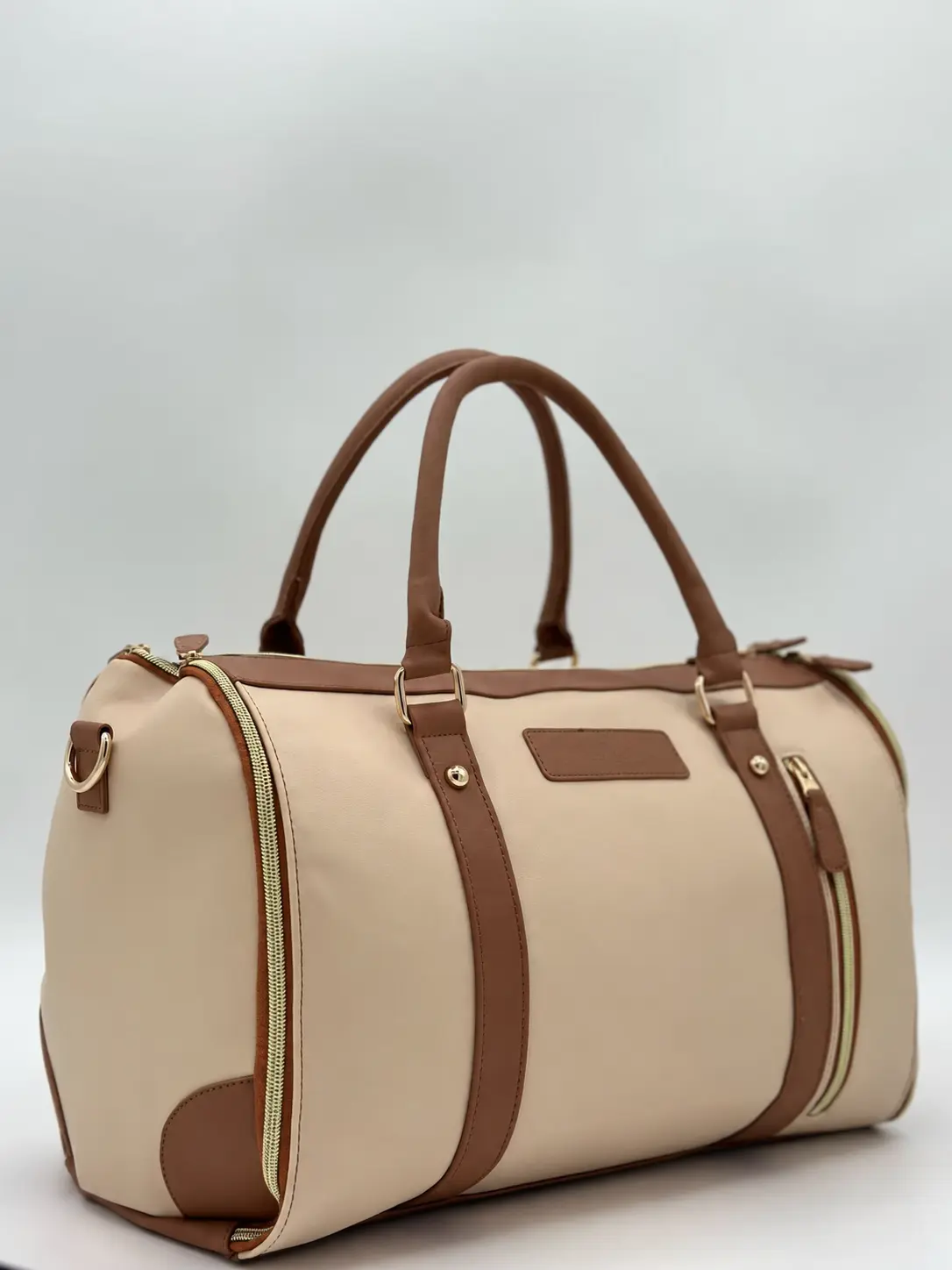 Anonymous beige and brown PU travel bag made for a French retail customer