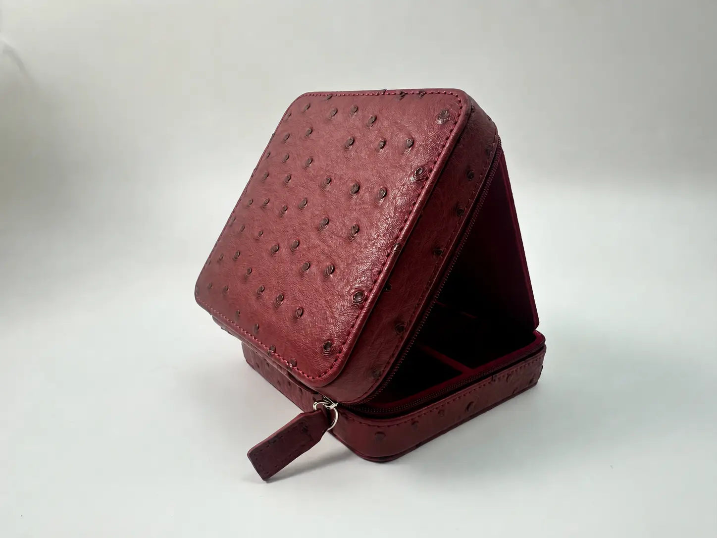 Anonymous angled view of red ostrich-textured PU jewelry box
