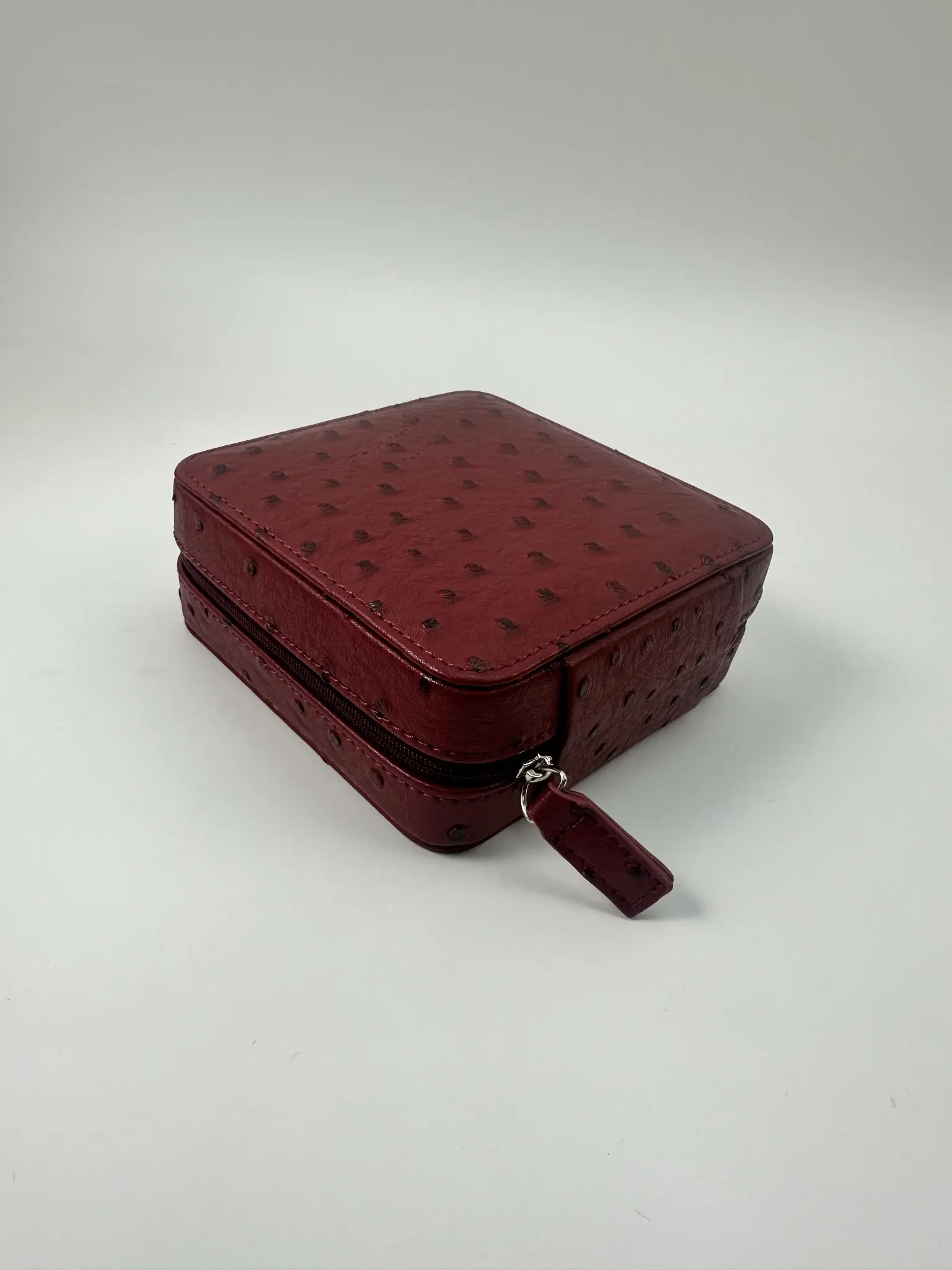 Closed red ostrich-textured PU jewelry box for a Russian buyer